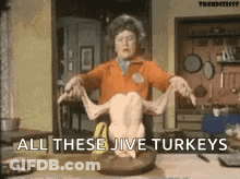 Woman Holding Turkey Saying All These Jive Turkeys GIF