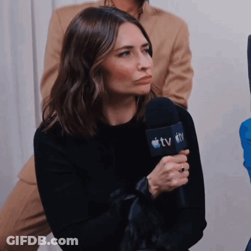 Woman Holding TV Microphone GIF