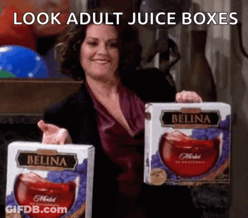 Woman Holding Two Boxes Of Belina Juice GIF