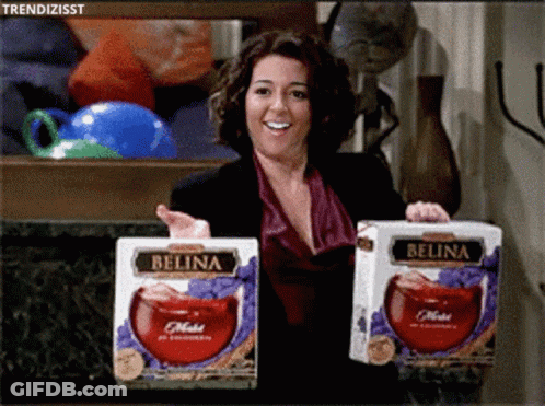 Woman Holding Two Boxes Of Belina Juice GIF