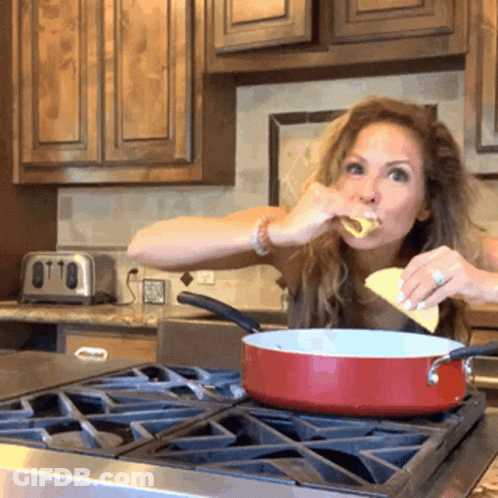 Woman Holding Two Tacos In Front Of Group GIF