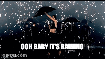 Woman Holding Umbrella In Rain Saying Ooh Baby It Rains GIF