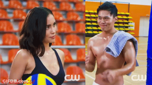 Woman Holding Volleyball Next To Shirtless Man With Towel GIF