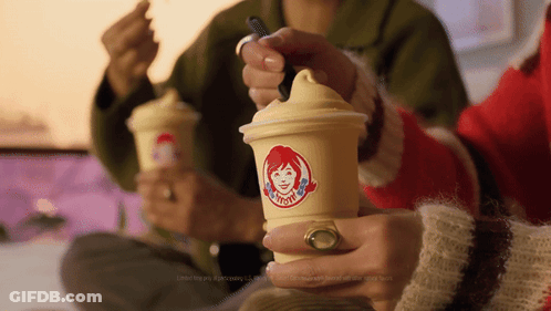 Woman Holding Wendy's Cup With Spoon GIF