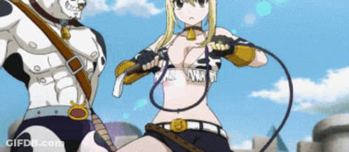 Woman Holding Whip And Man In Cow Print Outfit GIF