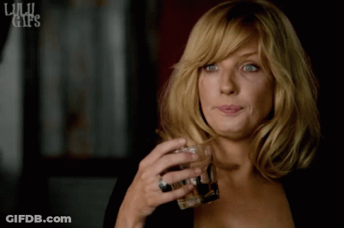 Woman Holding Whiskey Glass GIF