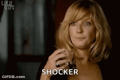 Woman Holding Whiskey Making Face GIF