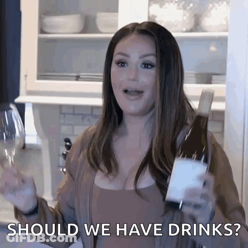 Woman Holding Wine Asks Should We Have Drinks GIF