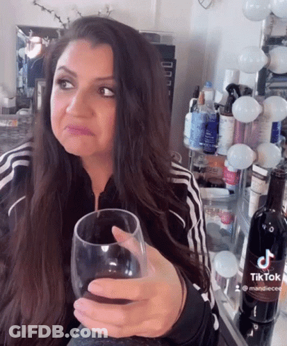 Woman Holding Wine Glass GIF