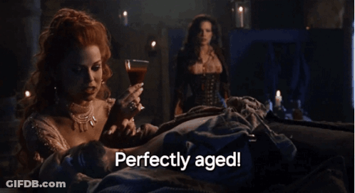 Woman Holding Wine Glass Perfectly Aged GIF