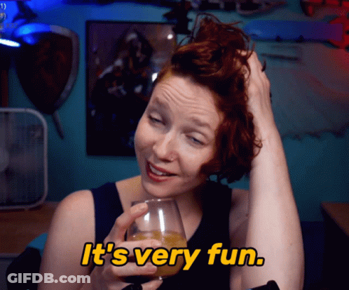 Woman Holding Wine Glass Saying It's Very Fun GIF