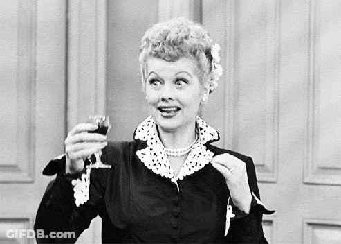 Woman Holding Wine Glass Smiling GIF