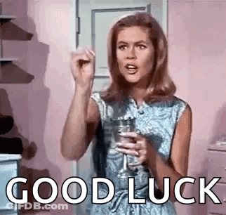 Woman Holding Wine Saying Good Luck GIF