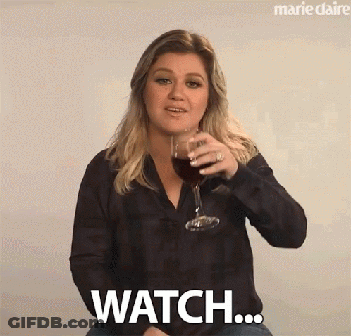 Woman Holding Wine Saying Watch GIF