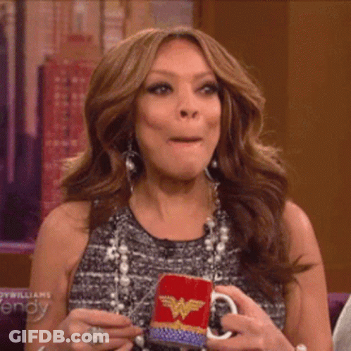 Woman Holding Wonder Woman Mug Making Face GIF