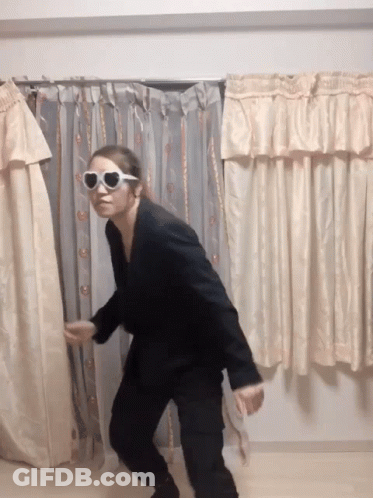 Woman Holding Wrestling Championship Belt On Stage GIF