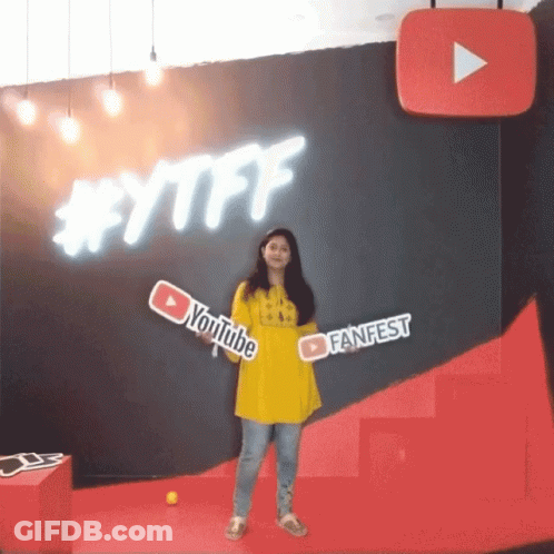 Woman Holding YouTube FanFest Sign GIF