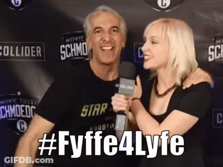 Woman Hugging Man Holding Microphone #Fyffe4lyfe GIF