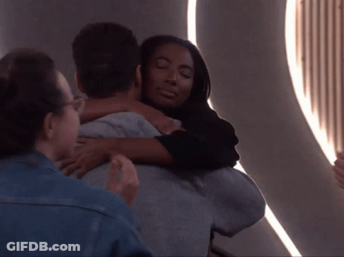 Woman Hugging Man In Room GIF
