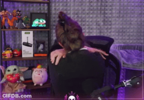 Woman Hugging Man In Stuffed Animal Room GIF