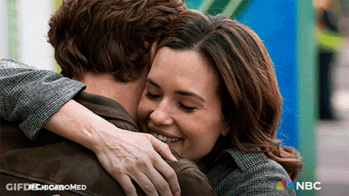 Woman Hugging Man With Chicagomed Logo GIF