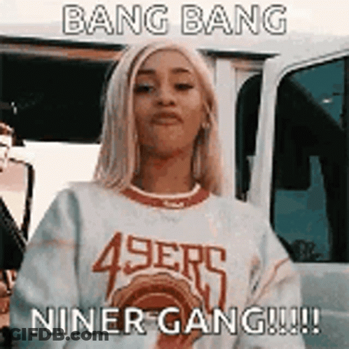 Woman In 49Ers Sweater Standing In Front Of Car GIF