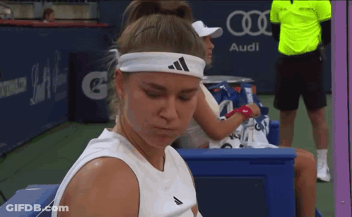 Woman In Adidas Headband On Bench At Audi Sign GIF