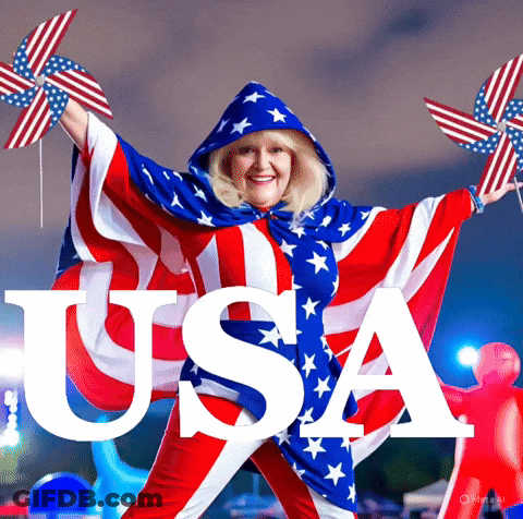 Woman In American Flag Cape Holding Pinwheel Toys GIF