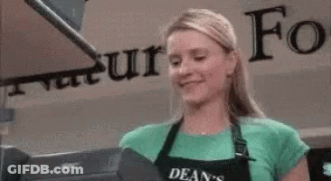 Woman In Apron At Cash Register GIF