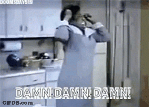Woman In Apron Drinking Water In Kitchen GIF