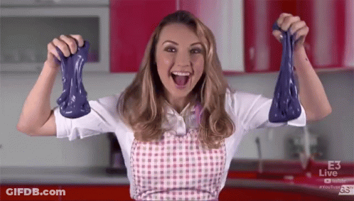 Woman In Apron Holding Purple Slime GIF