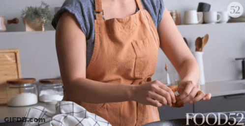 Woman In Apron Preparing Food With Food52 GIF