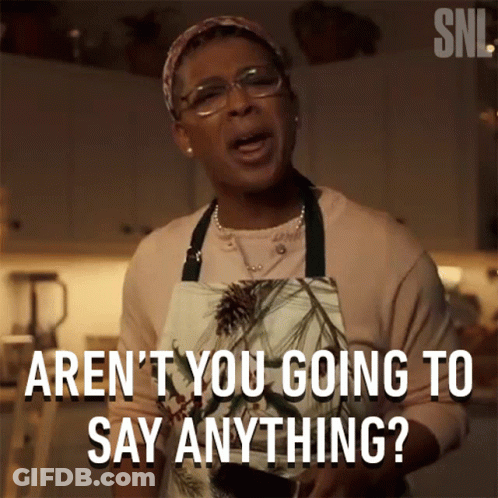 Woman In Apron Saying Aren't You Going To Say Anything GIF