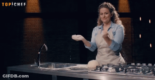Woman In Apron Throwing Flour Under Top Chef Sign GIF