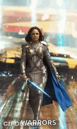 Woman In Armor Holding Sword And Cape GIF