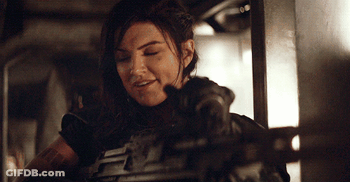 Woman In Armor Lying On Bed GIF