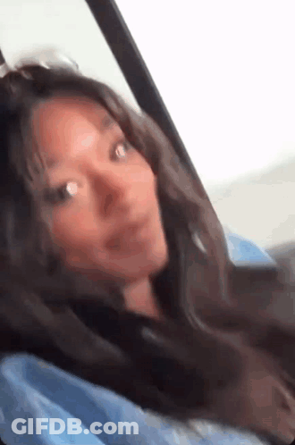 Woman In Back Seat Looking Out Window GIF