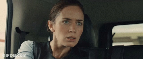 Woman In Back Seat Of Car Looking At Camera GIF