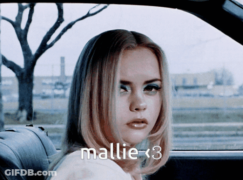 Woman In Back Seat Of Car With Name Mallie < 3 GIF