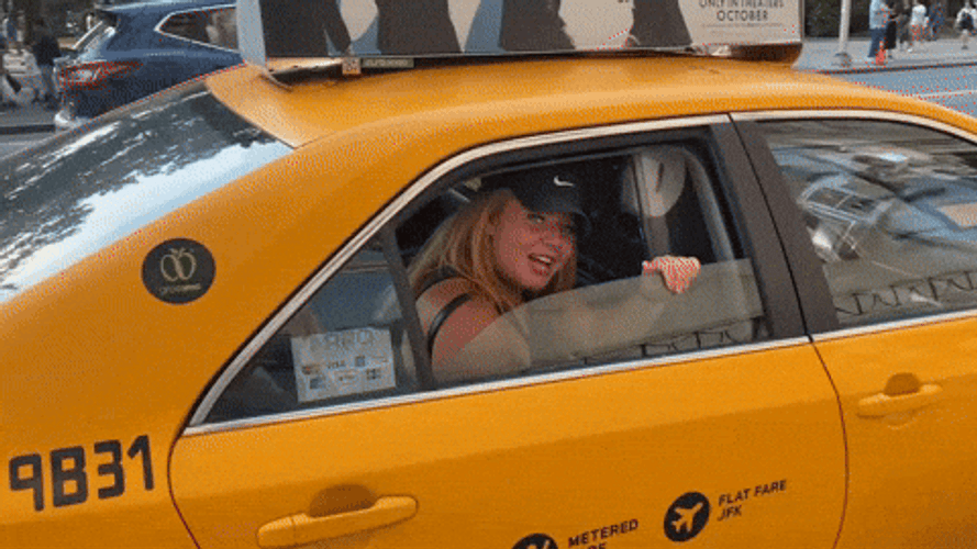 Woman In Back Seat Of Taxi GIF