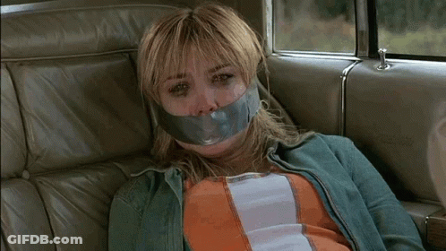 Woman In Back Seat With Duct Tape On Face GIF
