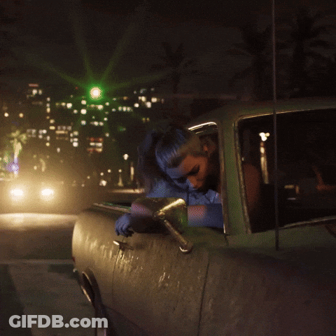 Woman In Backseat Looking At Camera GIF