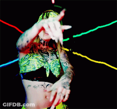 Woman In Bandana And Crop Top Dancing In Dark Room GIF
