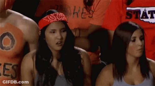 Woman In Bandana Next To Man In Hey State Shirt GIF