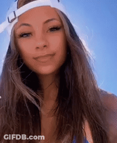 Woman In Baseball Cap And Blue Bikini Smiling GIF