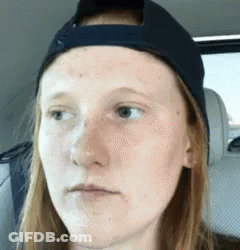 Woman In Baseball Cap Making Funny Face In Back Seat GIF