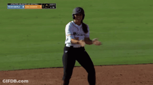 Woman In Baseball Uniform On Field GIF