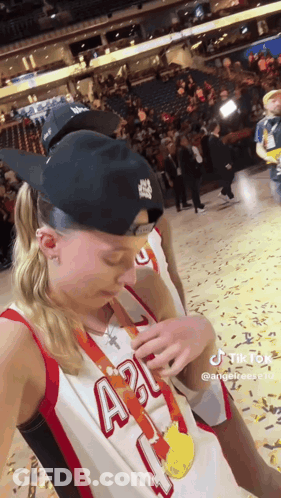 Woman In Basketball Uniform Taking Selfie With Medal GIF