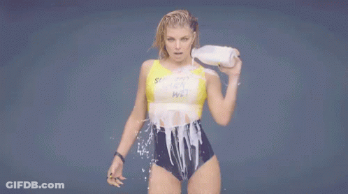 Woman In Bathing Suit Holding Milk GIF