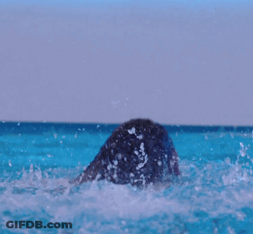Woman In Bathing Suit In Pool With Necklace GIF